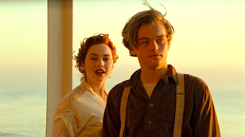 Kate Winslet and Leonardo DiCaprio stand on deck in Titanic