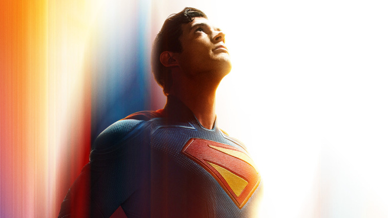 Superman flies upwards, looking up into the sky