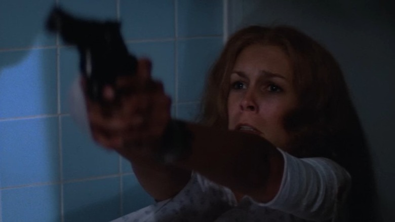 Halloween II's Laurie holding pistol