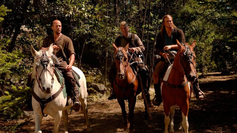 Camden, Norick, and a fellow adventurer, all on horseback in the woods.