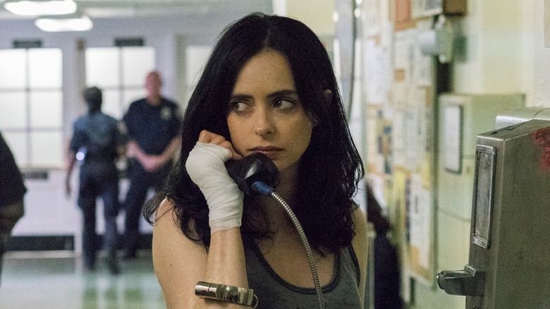 Krysten Ritter using a payphone as Jessica Jones