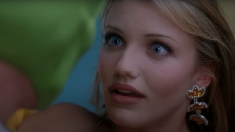 Cameron Diaz's Tina Carlyle widens her eyes as she stares up at Jim Carrey's Stanley Ipkiss in The Mask