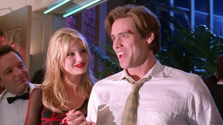 Cameron Diaz's Tina Carlyle stands smiling alongside Jim Carrey's Stanley Ipkiss in The Mask