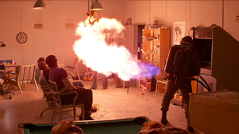 Kurt Russell incinerates an assimilation in The Thing