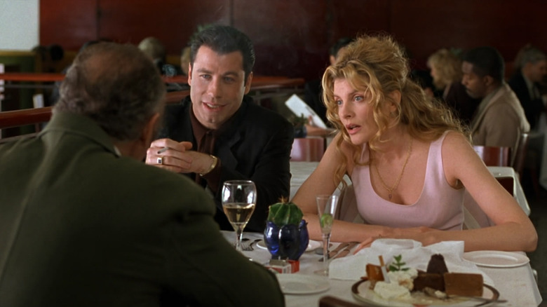 John Travolta and Rene Russo at dinner in Get Shorty