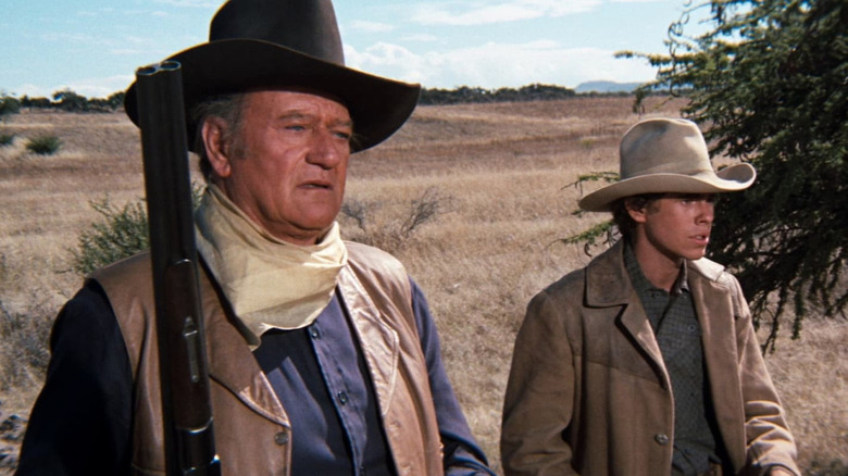 John Wayne as J.D. Cahill tracks down outlaws with Gary Grimes as Daniel Cahill in Cahill U.S. Marshal