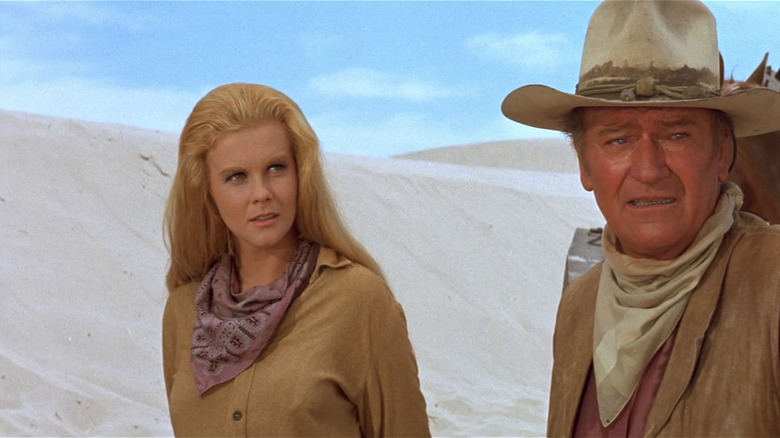 John Wayne and Ann Margaret in the desert in The Train Robbers