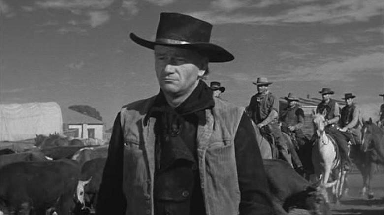 John Wayne is preparing for a cattle reader as Thomas Dunson in Red River