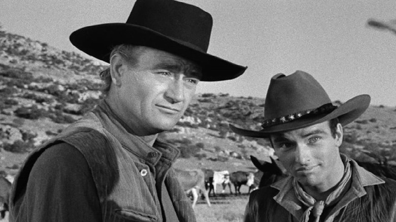 John Wayne as Thomas Dunson and Montgomery Clift while Matt Garth shares a rare calm moment in Red River