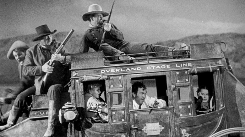 John Wayne on carriage roof Stagecoach