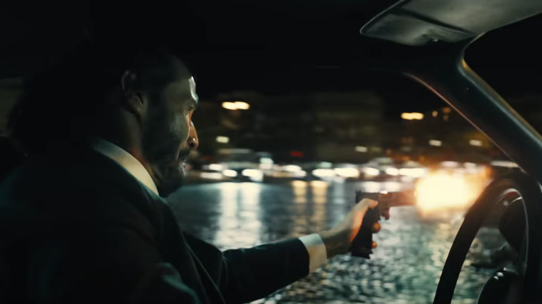 John Wick 4 Keanu Reeves driving shooting