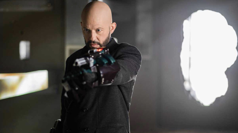 Jon Cryer as Lex Luthor brandishing his weapon in the Supergirl episode The Quest for Peace