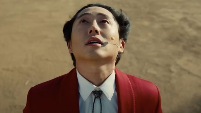 Steven Yeun looking up