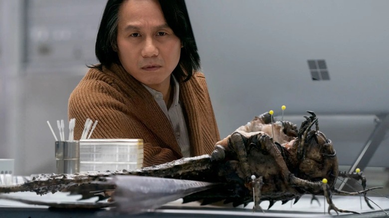 Jurassic World Dominion dr wu looking at locust