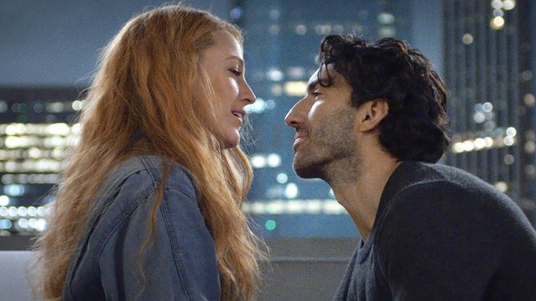 Blake Lively as Lily Bloom and Justin Baldoni as Ryle Kincaid, facing each other on a balcony, in It Ends With Us