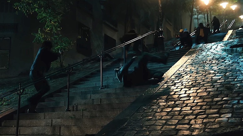 Keanu Reeves during the stair fight in John Wick: Chapter 4