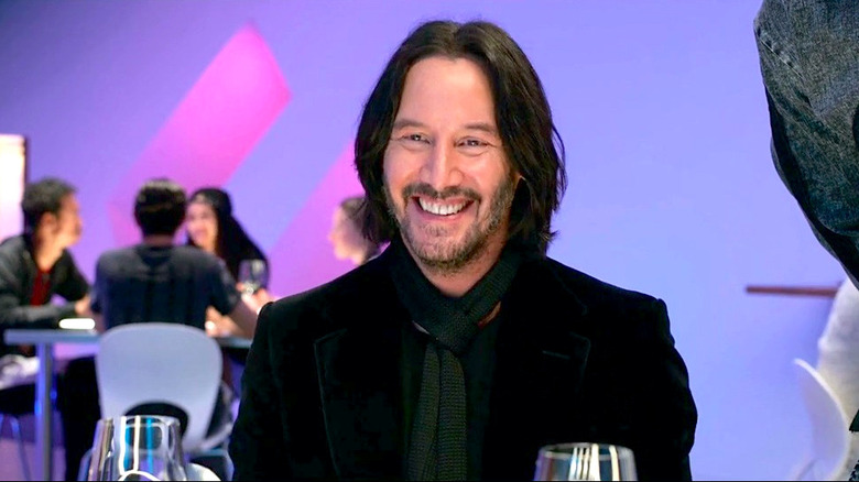 Keanu Reeves smiles at his dinner guests in Always Be My Maybe