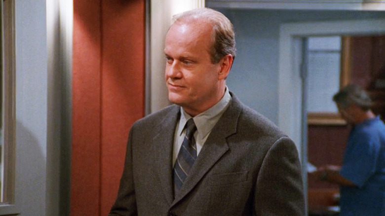 Kelsey Grammer's Frasier Crane stands in his KACL studio in Frasier