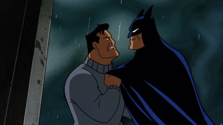 Bruce Wayne facing the image of Batman in Batman: The Animated Series