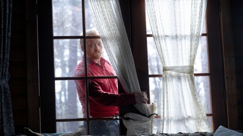 Rupert Grint breaking in in Knock at the Cabin