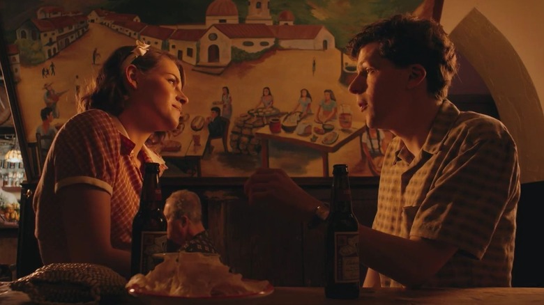 Kristen Stewart and Jesse Eisenberg at a bar in Cafe Society