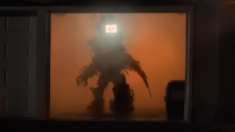 Techno monster stands in a smoky, orange-lit garage in Y2K