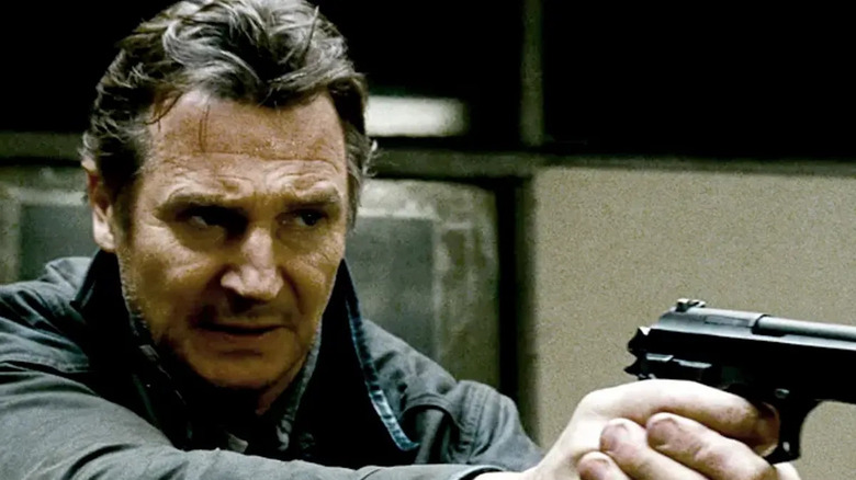 Liam Neeson targets a pistol like Bryan Mills in Taked 2