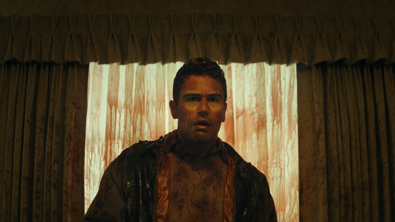 Theo James as Hal covered in blood in The Monkey (2025)