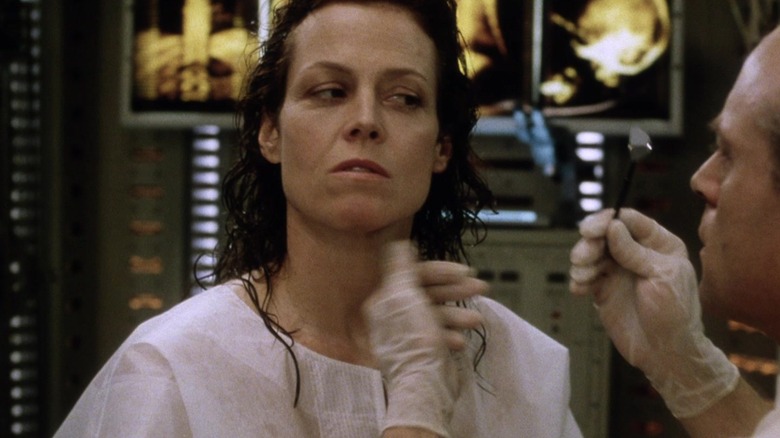 Sigourney Weaver as Ellen Ripley's clone looking distrusting in Alien: Resurrection