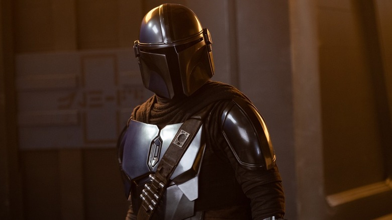 Din Djarin in his armor looking to his left in The Mandalorian