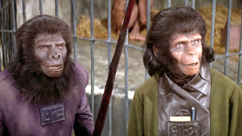 Kim Hunter as Dr. Zira and a gorilla looking surprised in Planet of the Apes (1968)