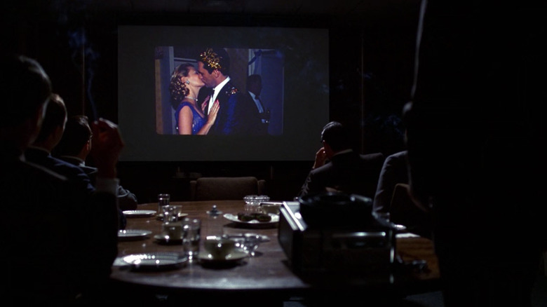 Ad executives watching projector in Mad Men