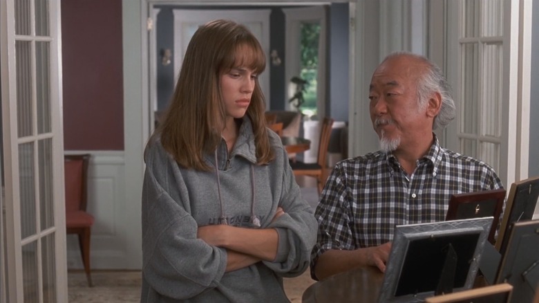 Julie standing next to Mr. Miyagi in The Next Karate Kid