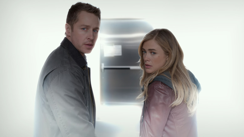 Josh Dallas and Melissa Roxburgh as Ben and Michaela, bathed in white light walking toward the plane door on Manifest