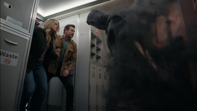 Josh Dallas and Melissa Roxburgh as Ben and Michaela fighting a ghostly spirit on Manifest