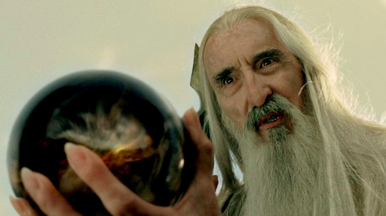 Saruman looks into his palantír in The Lord of the Rings: Return of the King