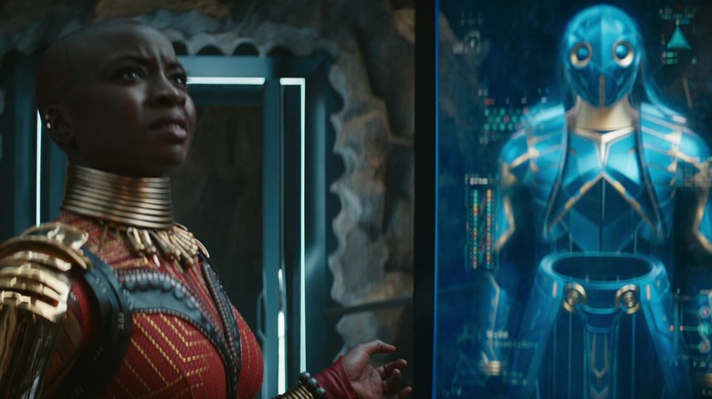 Danai Gurira's Okoye looking at the Midnight Angel suit design in Black Panther: Wakanda Forever