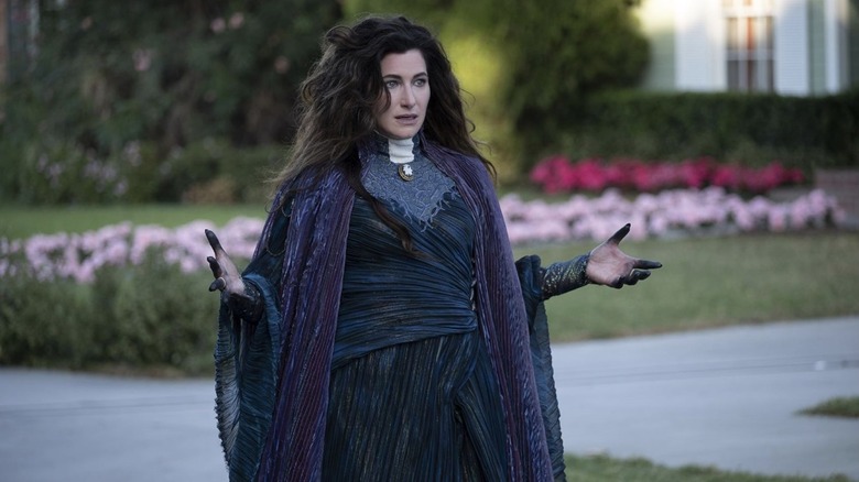 Agatha Harkness in her witch's robes, outdoors in the suburbs.