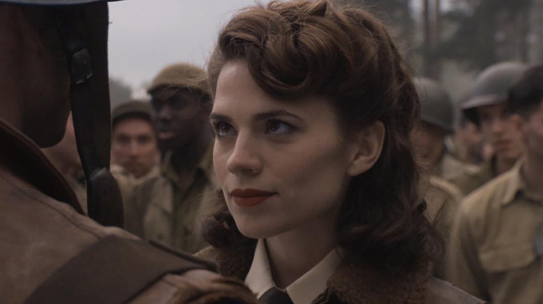 Hayley Atwell as Peggy Carter looking up at Steve Rogers in Captain America: The First Avenger