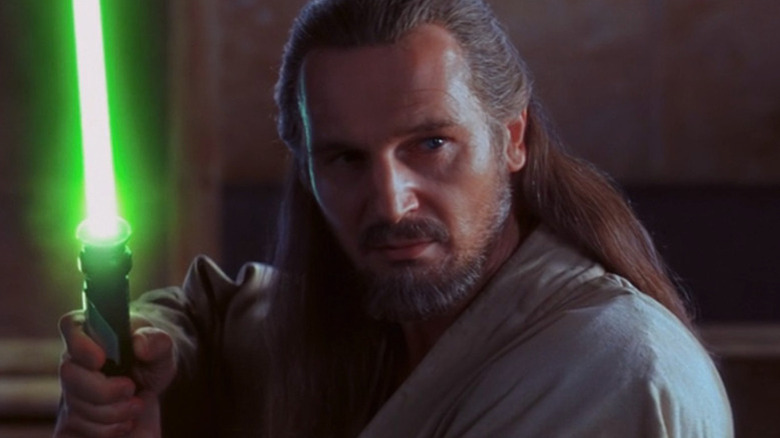 Qui-Gon Jinn holding green lightsaber in Star Wars: The Phantom Menace