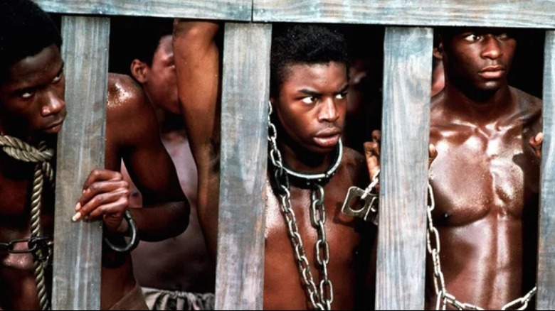 Kunta, other men in cage