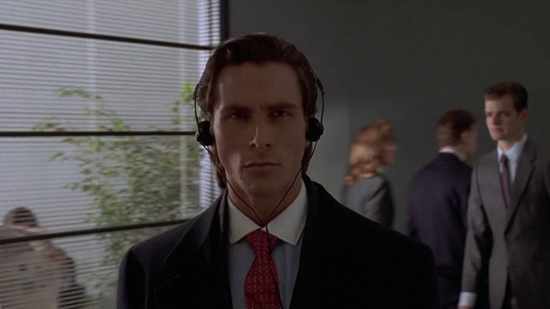 Patrick Bateman walking with headphones