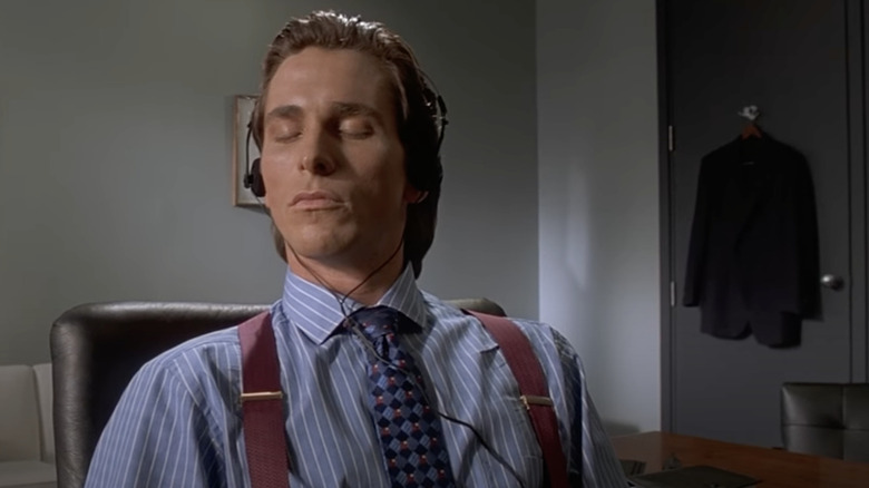 American Psycho Patrick Bateman calmly listening to music