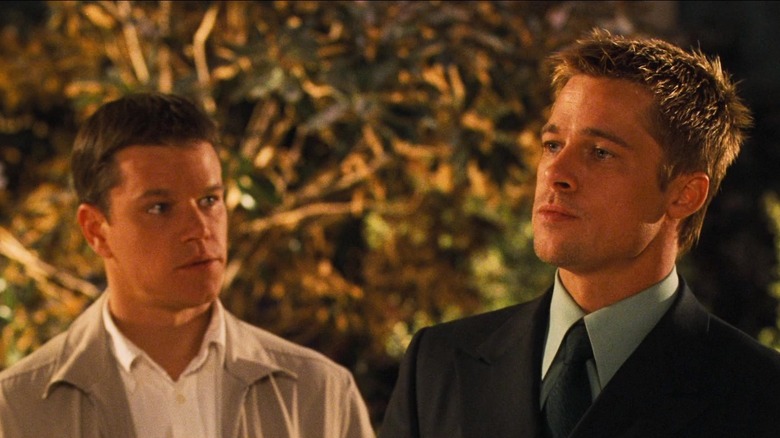 Matt Damon as Linus Caldwell and Brad Pitt as Rusty Ryan scoping out a casino in Ocean's Eleven