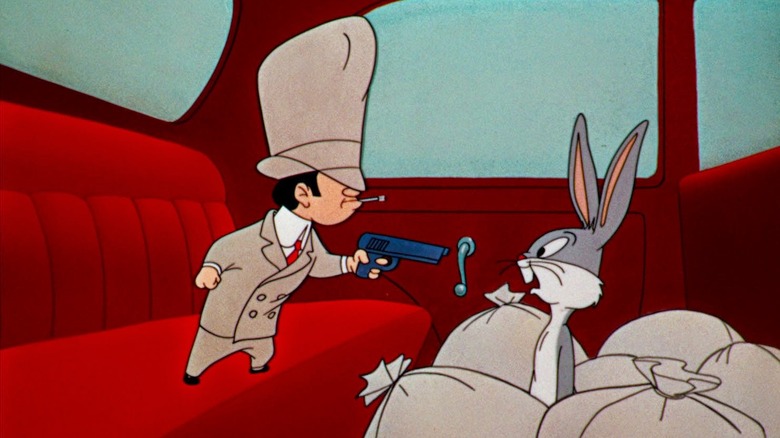 Rocky holds Bugs Bunny under the threat of weapons in insects and thugs