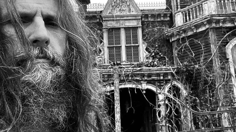 A photo of Rob Zombie outside of The Munsters house