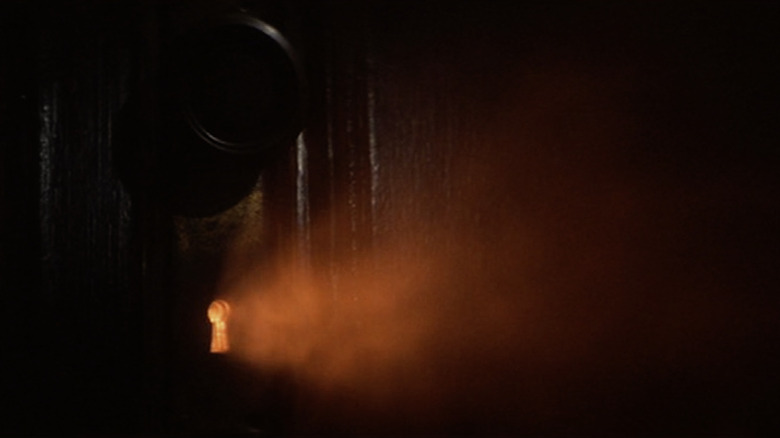 A doorknob with a light peeking through it in Close Encounters of the Third Kind