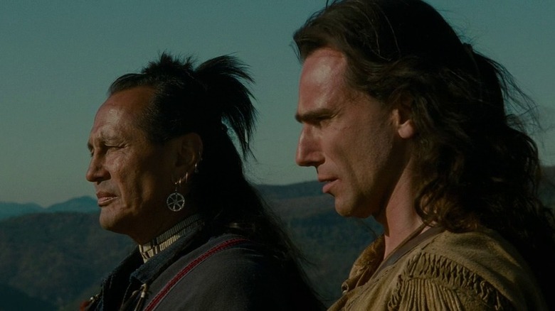 Last of the Mohicans Hawkeye stands with Chingachgook