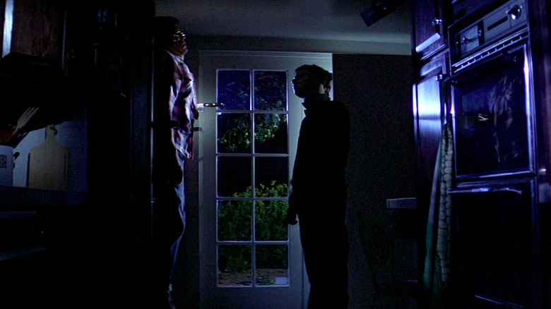 Nick Castle observes one of his victims in Halloween