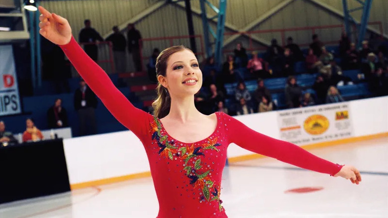 Gen performing in a red costume in Ice Princess